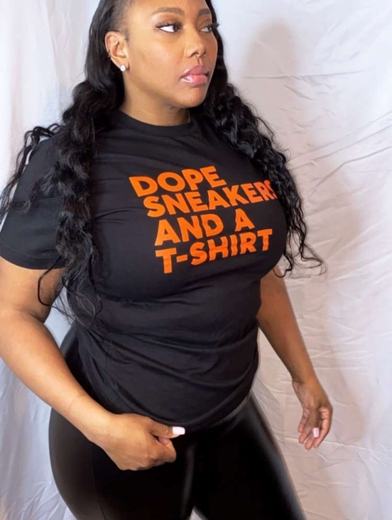 None Tops - Black Graphic T-Shirt with Bold Orange Text